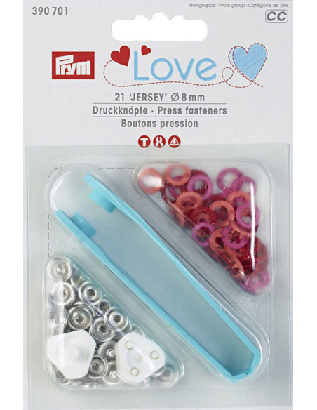 Doos met 21 drukknopen in rood, koraal en fuchsia met 8 mm gereedschap.
